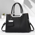 Elegant black lychee leather handbag with silver U-shaped metal handles and shoulder strap - Black