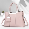 Pale pink lychee grain leather handbag with silver hardware and mini charm accessory - Pink