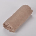 Linen cotton lightweight summer scarf in light brown rolled up on white background - 13# Khaki