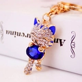 Golden lucky cat keychain with sparkling blue gemstone and crystal rhinestones for bags - Deep Blue