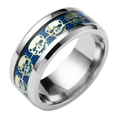 Silver skull ring featuring golden skull reliefs and a dark blue glitter inlay band - US 6 / Blue with Gold Gear