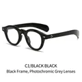 Gafas de sol ovaladas retro montura negra C1 remaches dorados y lentes fotocromáticas - Montura negra cambia a lentes grises