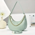 Mint green crescent shoulder bag with golden chain and lychee pattern finish - Green