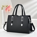 Elegant black woven tote bag with silver hardware and detachable strap on white background - Black