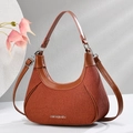Elegant orange-brown hobo shoulder bag with pleated fabric and premium brown leather trim - Earthy Yellow