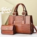 Detail of caramel brown tote bag with crocodile embossing and detachable metal chain - Earthy Yellow