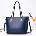 Elegante dunkelblaue Ledershopper mit Goldbeschlägen und verstellbarem Schultergurt - Blau