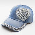 Detail of light blue denim baseball cap with heart-shaped pearls and rhinestone brim - Pearl Heart / Light Denim Blue