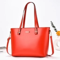 Close-up of red tote bag with gold metal hardware and detachable long shoulder strap - Red