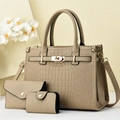 Detail view of khaki faux crocodile skin tote bag set with metal twist lock hardware - Light Khaki