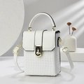 Detailed view of white faux crocodile texture and gold twist lock on women's crossbody bag - White