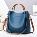 Navy blue lychee leather handbag with contrasting brown straps and gunmetal hardware - Blue