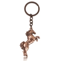 Detailed view of a vintage bronze metal horse keychain with intricate carving and ring - Running Horse Antique Red Copper