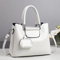 Detail of white crocodile texture handbag with dual handles and mini coin purse pendant - With Pouch Pendant / White