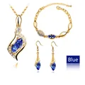 Close-up of gold-plated jewelry set with blue marquise crystals and white gems - Gold Royal Blue