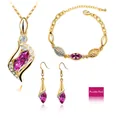 Detailed shot of fuchsia crystal jewelry set with marquise cut stones and gold plating - Gold Purple