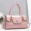 Elegant light pink patent leather handbag with gold shell hardware and top handles - Pink