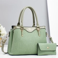 Detail view of light green pleated leather tote bag with matching coin purse and gold hardware - Green