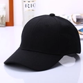 Detailed side view of a classic black six-panel baseball cap with a curved brim design - Black
