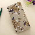 Flat lay of a beige floral kraft paper notebook with a green pencil on a textured surface - 90*170mm / Gray