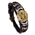 Multilayer woven brown leather bracelet featuring an antique bronze Libra zodiac charm - Libra