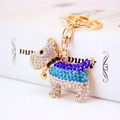 Sparkling rhinestone puppy keychain with blue crystals and a small golden bell - Blue