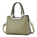 Olive green litchi grain leather handbag with silver metal trim and adjustable strap - Green