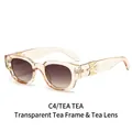 Gafas de sol ovaladas transparentes color té con detalles de pájaro y espada dorados - Marco Té Transparente Lentes Degradadas Té (C4)