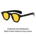 Lunettes ovales noires avec verres photochromiques jaunes à gris et rivets en métal - Monture noire verres jaune à gris