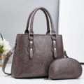 Elegant grey pebbled leather handbag set with top handles and adjustable crossbody strap - Gray