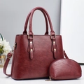 Elegant burgundy wine red faux leather handbag set with matching small round coin purse - Red