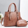 Brown faux leather handbag with matching coin purse and adjustable shoulder strap set - Pink