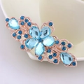 Elegant gold metal hair clip featuring blue faceted crystals in a floral design - Lake Blue Flower
