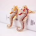 Golden seahorse keychain with sparkling rhinestones and red enamel decoration - Random Color