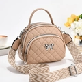 Gewatteerde mini crossbodytas lichtbruin met strikdetail en geweven schouderriem - 21x11x18 / Khaki