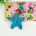 Detailed close-up of blue starfish keychain with rhinestones and leather tassel - Silver Lake Blue
