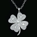 Detailed view of silver clover pendant with pave-set white sparkling crystals - Silver