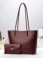 Detail of burgundy leather tote bag set with twill texture and matching wallet - Burgundy