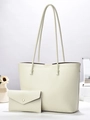 Close-up of beige tote bag set with vein pattern texture and matching envelope wallet - Off White