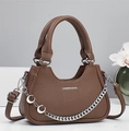 Close-up of brown litchi pattern leather handbag with silver chain and metal pendants - Dark Khaki