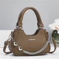 Brown lychee leather tote bag with silver chain and adjustable strap in minimalist setting - Khaki