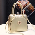 Elegant gold crossbody handbag with rhinestones and cat emblem for women - Gold