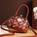Brown monogram shell tote bag with lychee texture and rhinestone clasp detail - Brick Red