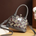 Large gray shell handbag with red H monogram and cute bear charm on a white pedestal - Dark Gray