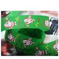 Macro detail of green Christmas grosgrain ribbon with Santa Claus and festive ho ho ho print - 2.5cm Green Santa Claus HoHoHo Ribbon (1 Yard)