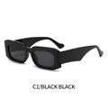 Chic black frame rectangle sunglasses with black grey lenses in a 45-degree side view - Black Frame Black Grey Lens