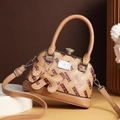 Chic light brown crossbody bag with all-over H pattern and cute puppy charm - Light Orange
