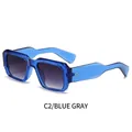 Translucent blue square sunglasses with gray gradient lenses and gold rivet accents - Transparent Blue Frame Grey Lens