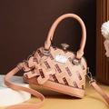 Elegant apricot shell crossbody bag with H-pattern monogram and crystal clasp detail - Flesh Pink