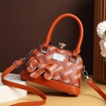Orange shell-shaped handbag with H-letter print, top handle, and crossbody strap - Orange Red